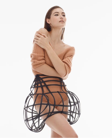 model grace elizabeth wears an off the shoulder sweater, briefs and a cage skirt