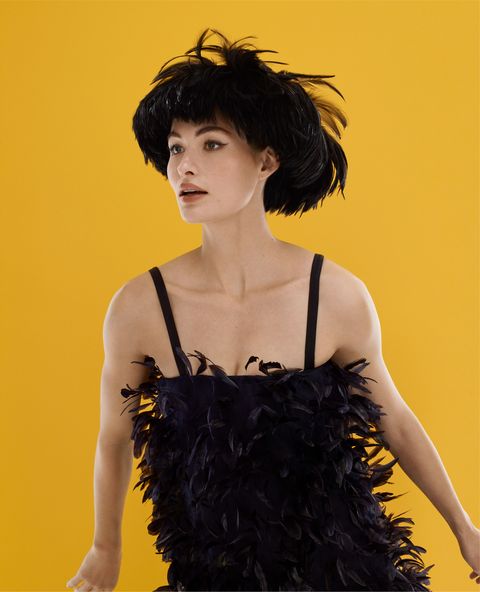 model grace elizabeth wears black feathered hat and dress