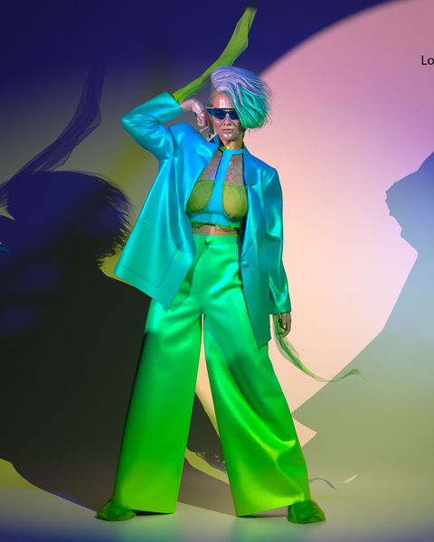 a virtual model wearing green pants and a bright blue jacket