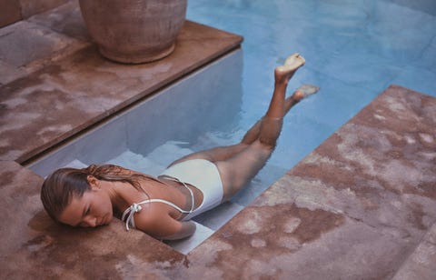 Anna Ewers takes a dip in a pool wearing a white swimsuit anna ewers takes a dip in a pool wearing a white swimsuit
