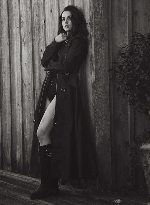 ana de armas in a coat and boots