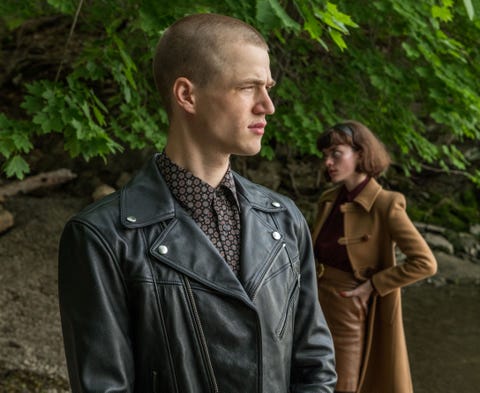 man in leather jacket and woman