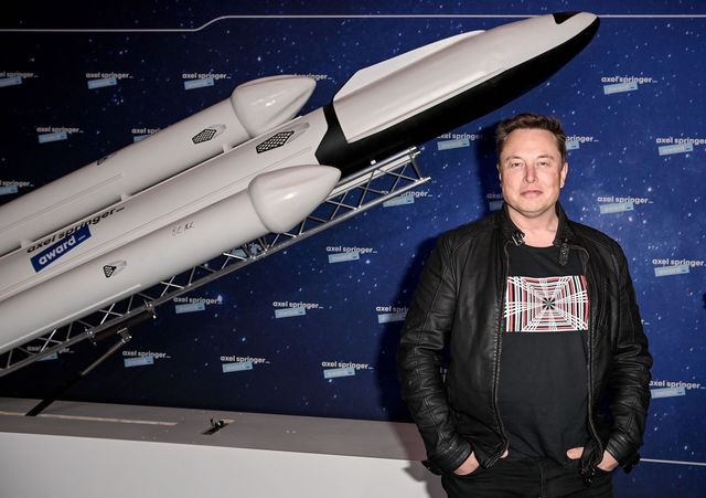 spacex owner and tesla ceo elon musk r gestures as he arrives on the red carpet for the axel springer awards ceremony, in berlin, on december 1, 2020 photo by britta pedersen  pool  afp photo by britta pedersenpoolafp via getty images