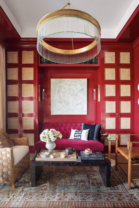 tea room with red walls and gold accents