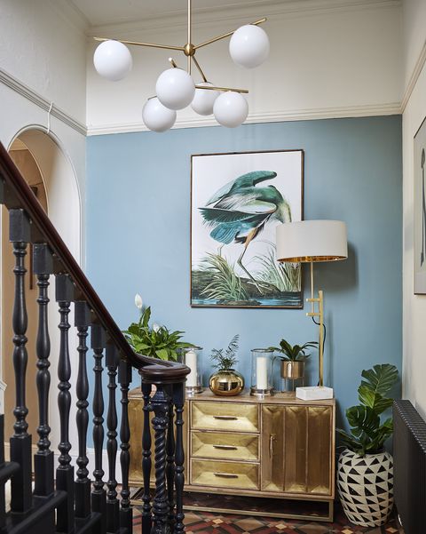 pale blue hallway with victoria tiled floor