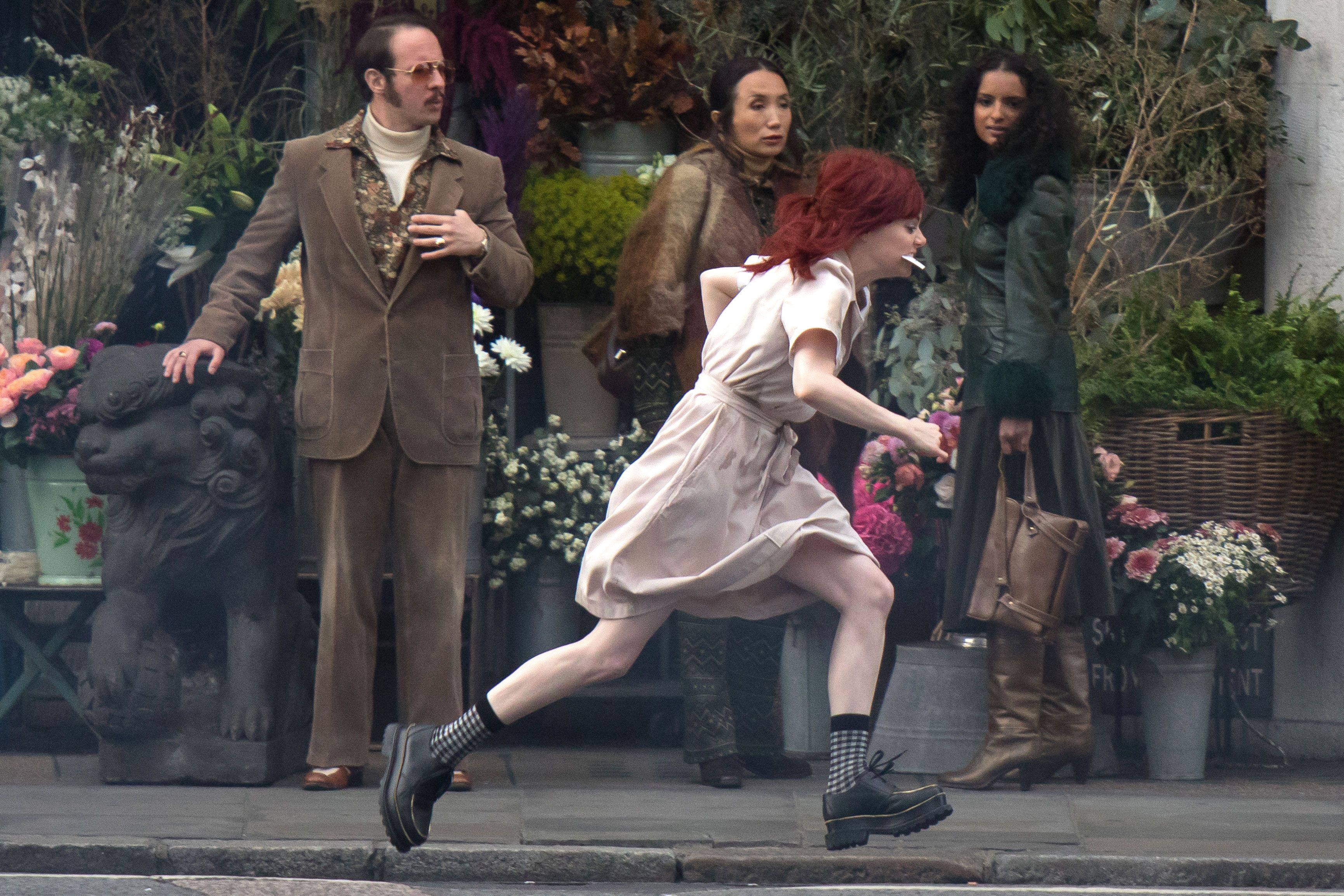 Emma Stone films dramatic scenes as red-haired Cruella de Vil