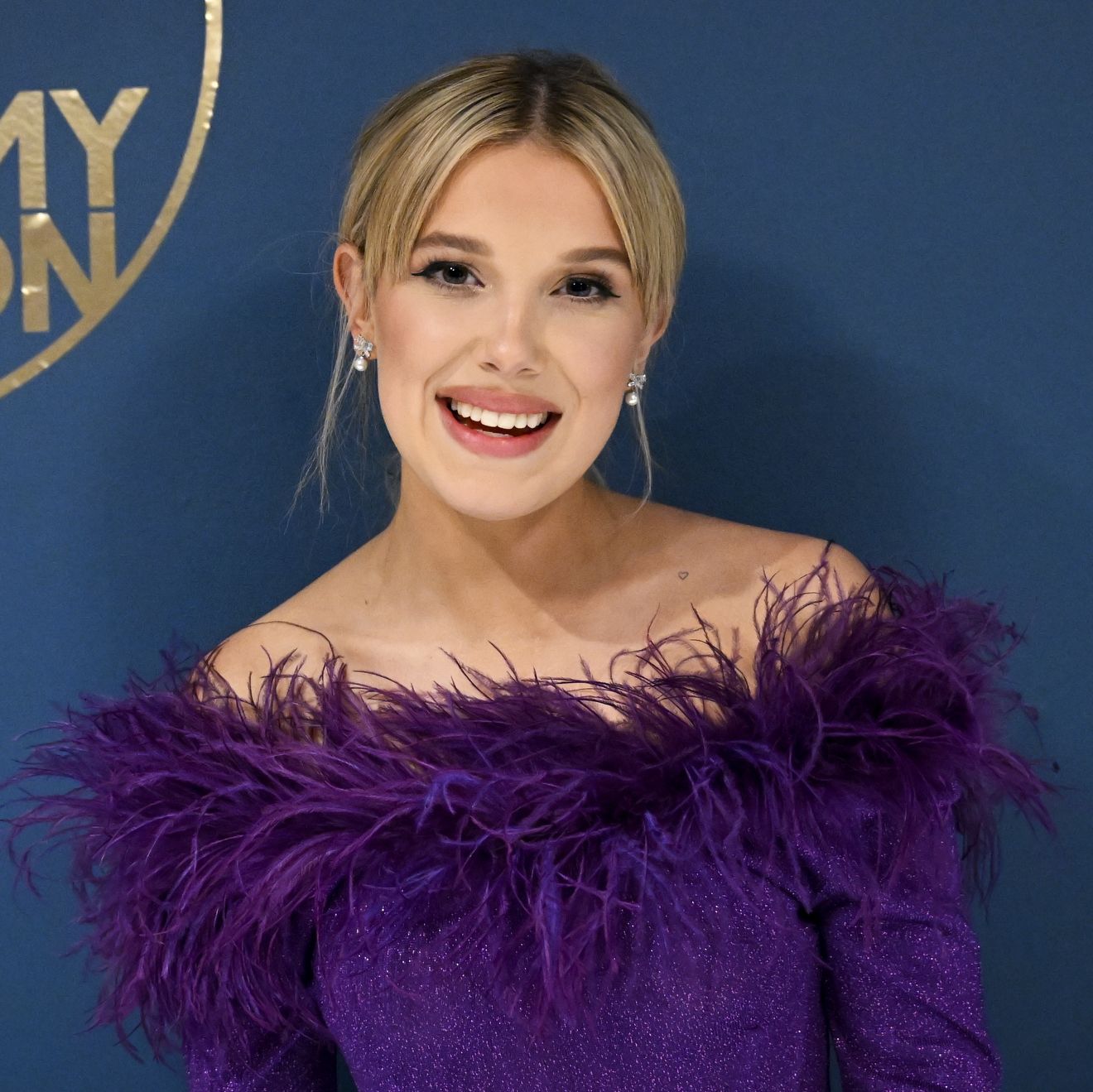 Millie Bobby Brown Is a Blonde Beauty In Head-to-Toe Purple