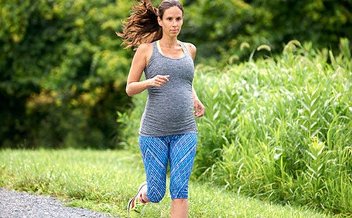 A Runner S Guide To Training Through Pregnancy Runner S World