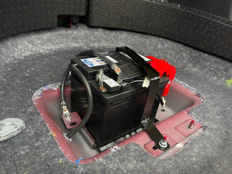 12 volt battery under the rear floor of a ford escape