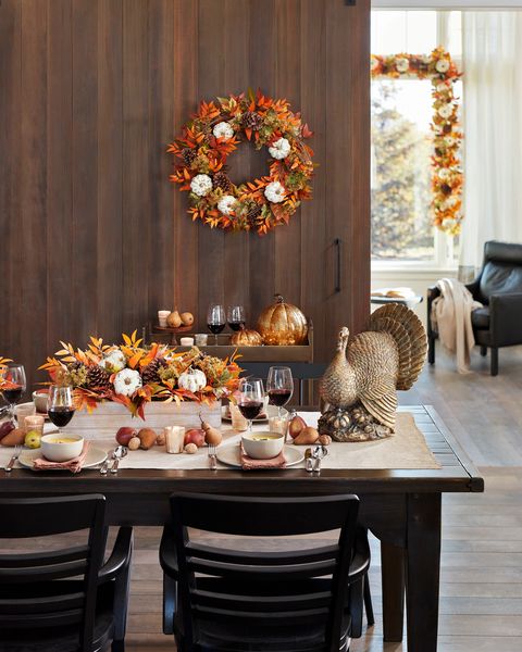 a thanksgiving tablescape with a bronze turkey