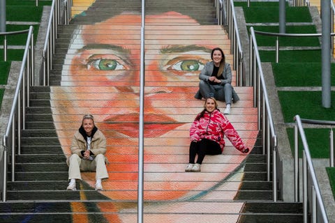 london, england   november 23 leah williamson, captain of the england womens football team, the lionesses,, helen hardy and artist charlotte archer attend a photocall as the national lottery celebrate those supporting women in sport by unveiling an impactful piece of artwork depicting helen hardy, founder of manchester laces   the first inclusive womens and non binary football club in manchester at wembley stadium on november 23, 2022 in london, england