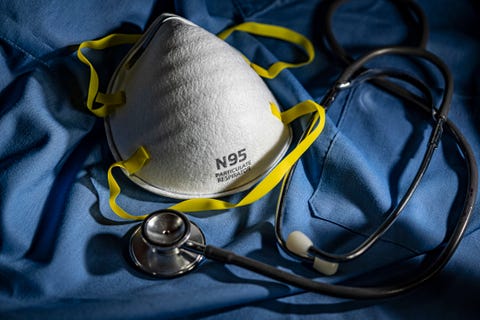 n95 face mask with stethoscope and scrubs