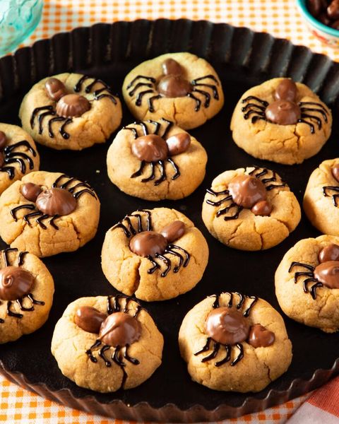 spider cookies on black tray