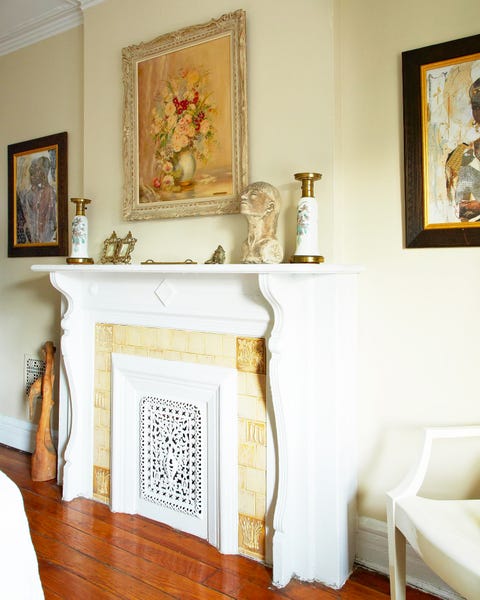 mantle with framed floral still life