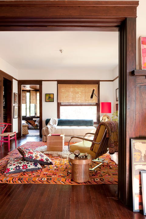 living room with orange rug