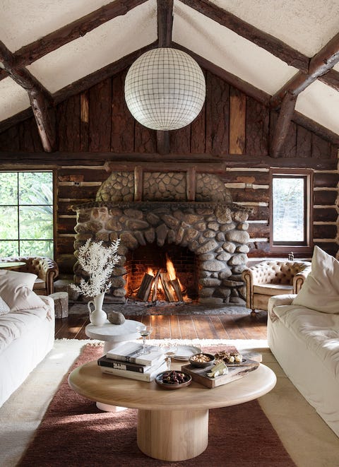 living room with stone fireplace