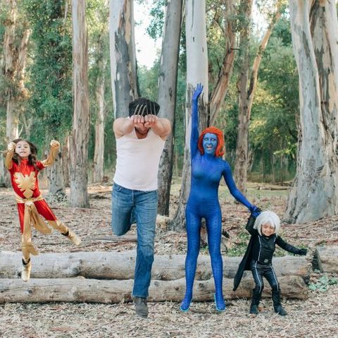 a family halloween costume featuring people dressed as x men including dark phoenix wolverine mystique and storm