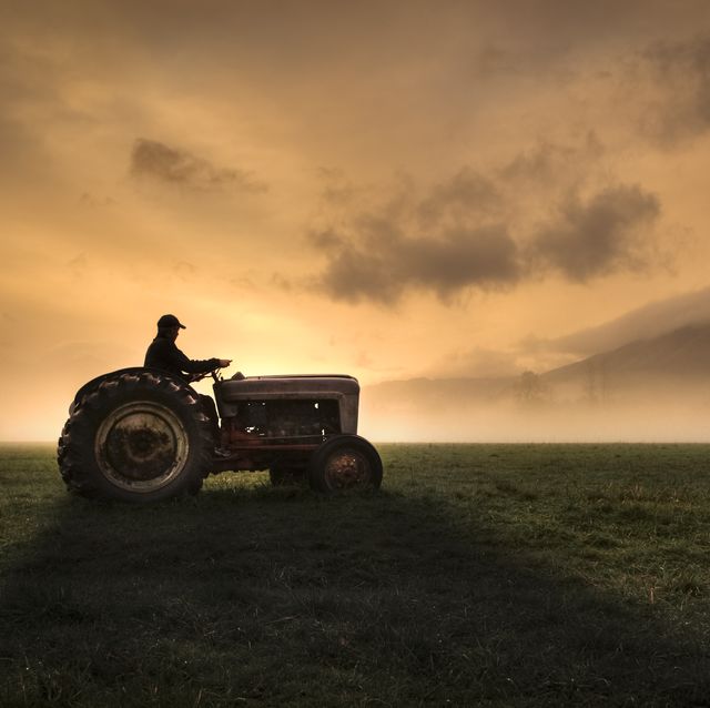 farmer riding tractor