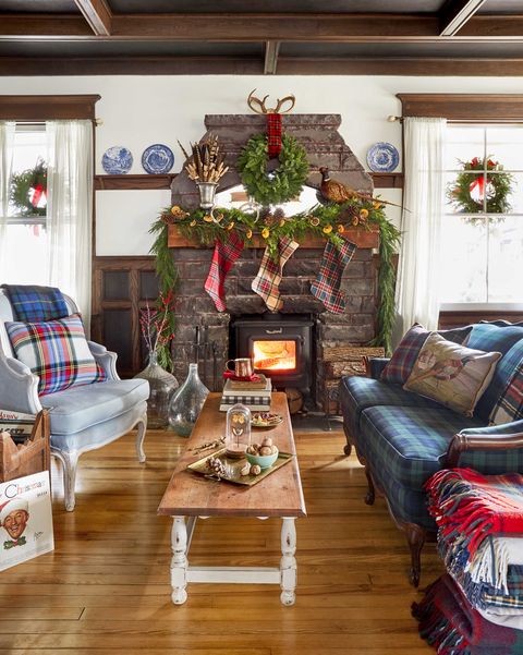 christmas farmhouse living room with stone fireplace