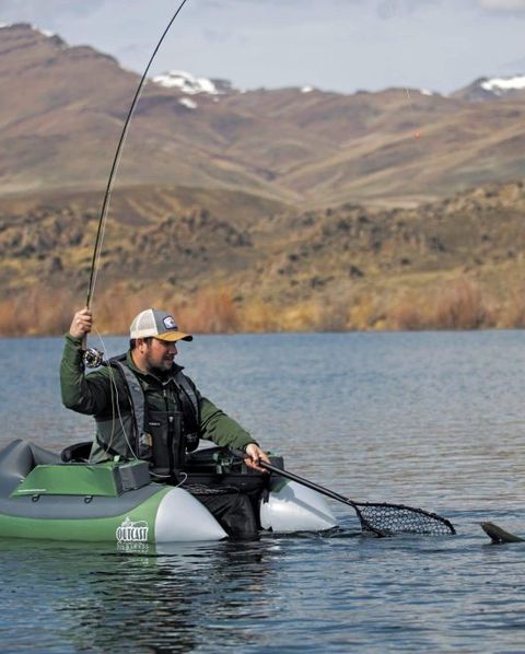 man fishing while sitting in outcast super fat cat float tube
