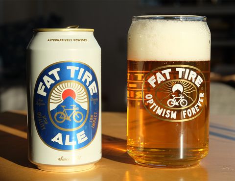 a can of fat tire next to a glass of beer