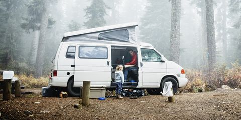 father in camper in discussion with daughter