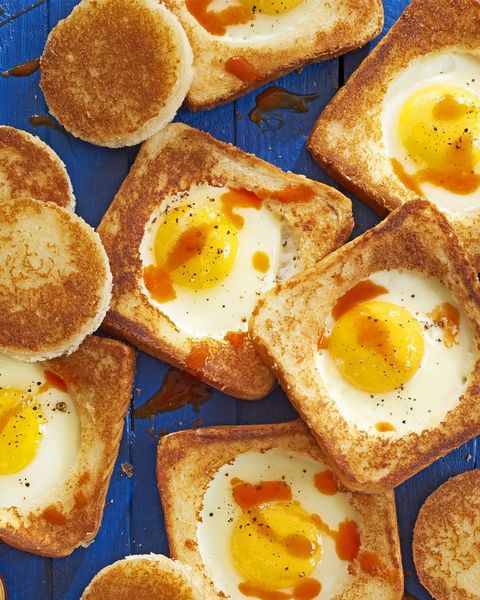 white toast with wholes cut out, and and egg cooked in the middle