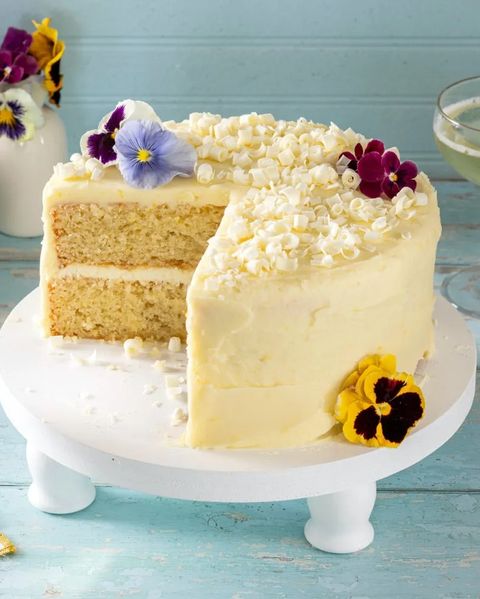 lemon cake with flowers on cake stand