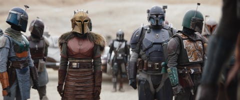 center, lr the armorer emily swallow, din djarin pedro pascal and paz vizsla tait fletcher in lucasfilm's the mandalorian, season three, exclusively on disney ©2023 lucasfilm ltd tm all rights reserved