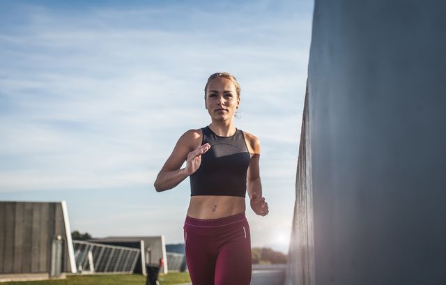 female athlete running outdoors