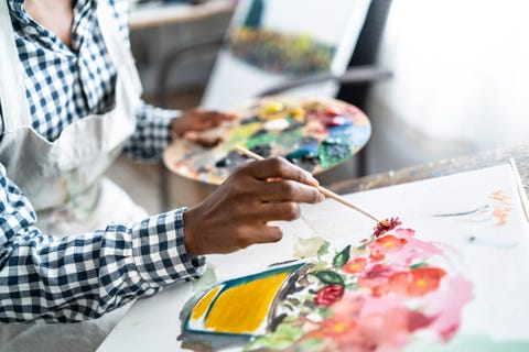 woman painting, drawing flowers