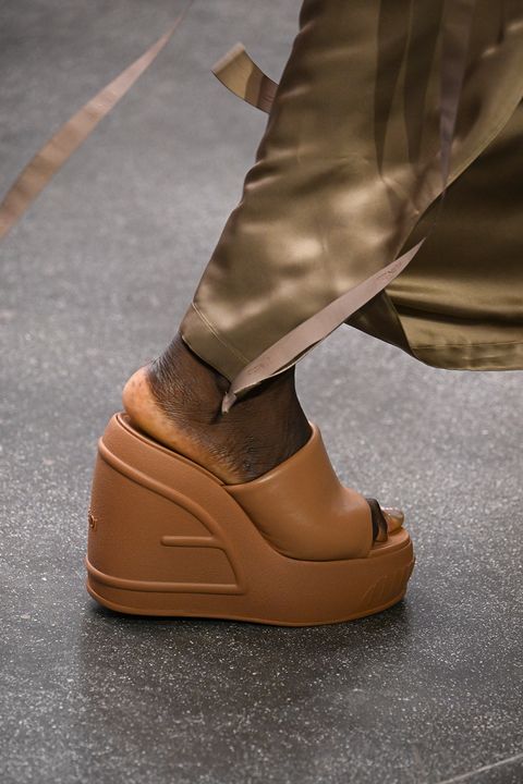 models wear spring shoes on a runway for a spring 2023 shoe trend guide