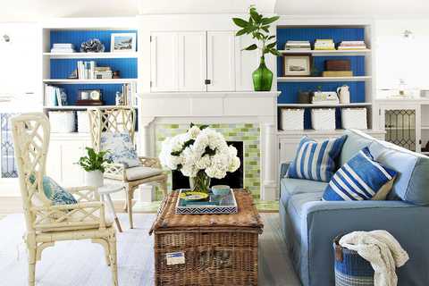 living room with green mosaic fireplace, pops of blue and coastal inspired furniture
