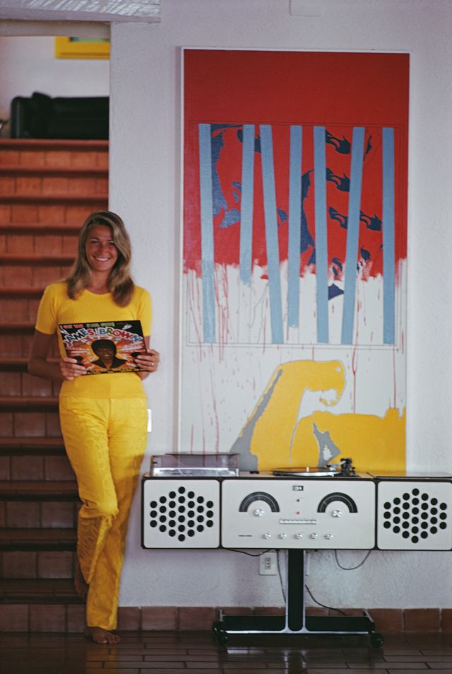 italian fashion designer, model and socialite, marta marzotto 1931   2016, playing a james brown album on an italian brionvega radiofonograph rr126 stereo system, porto ercole, tuscany, august 1969 photo by slim aaronshulton archivegetty images