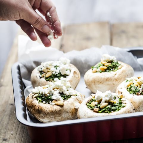 Filled champignons with spinach and feta in gratin dish