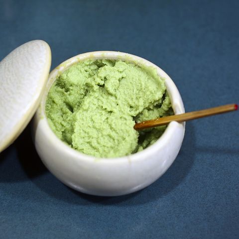 Finely grated wasabi served in porcelain container on table