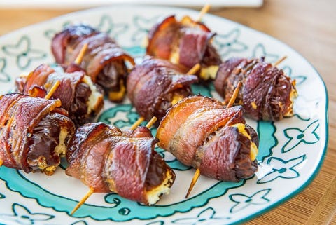 bacon wrapped dates on blue printed plate