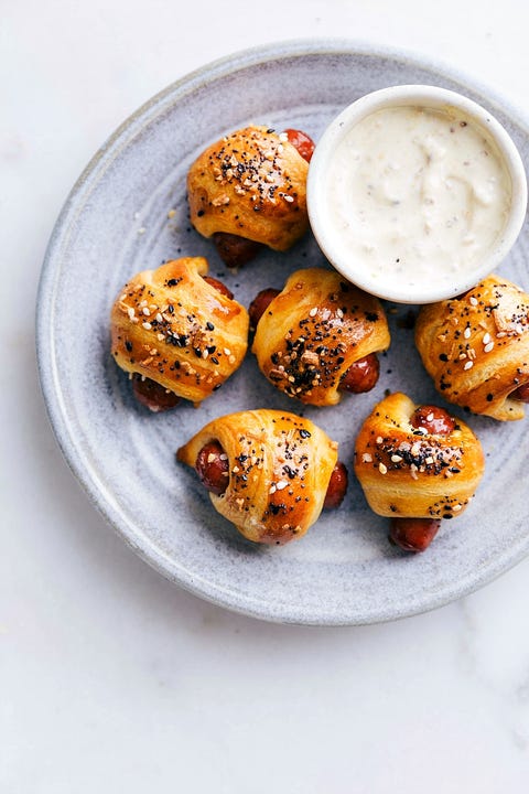 pigs in a blanket with white sauce on side