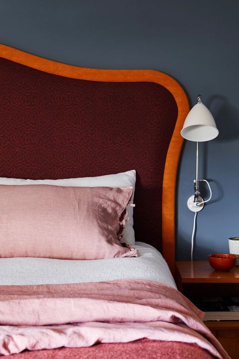bedroom with red and orange headboard
