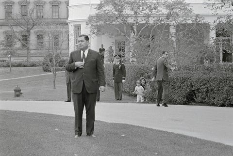 jacqueline kennedy and son watching ceremony