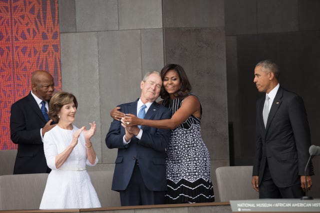 first-lady-michelle-obama-hugs-former-president-george-w-news-photo-1618850427.