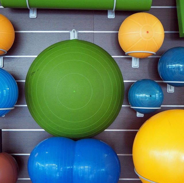 fitness balls arranged in gym
