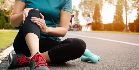 fitness woman runner feel pain on knee outdoor exercise activit