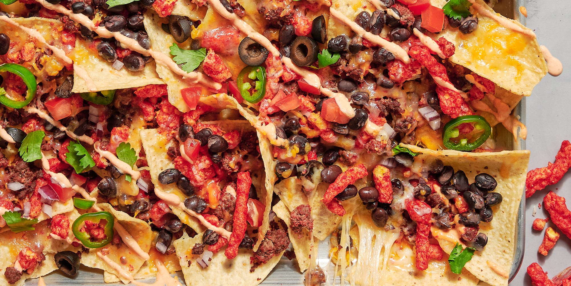 Sheet-Pan Nachos Get The Flaming Hot Treatment In This Easy Spin On The Game Day Must