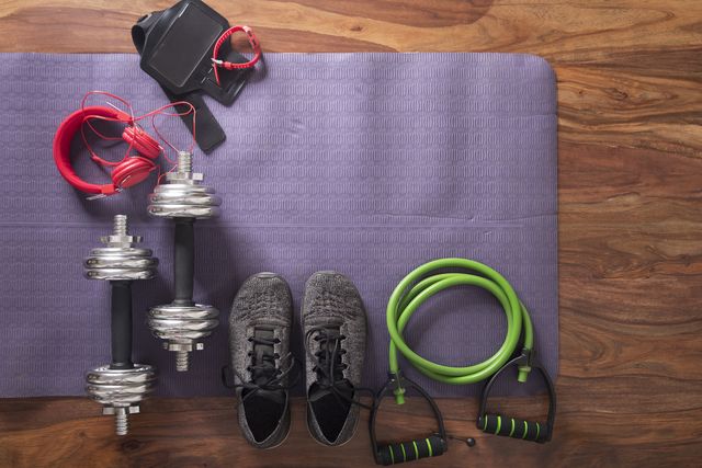 flat lay image of fitness equipment on yoga mat