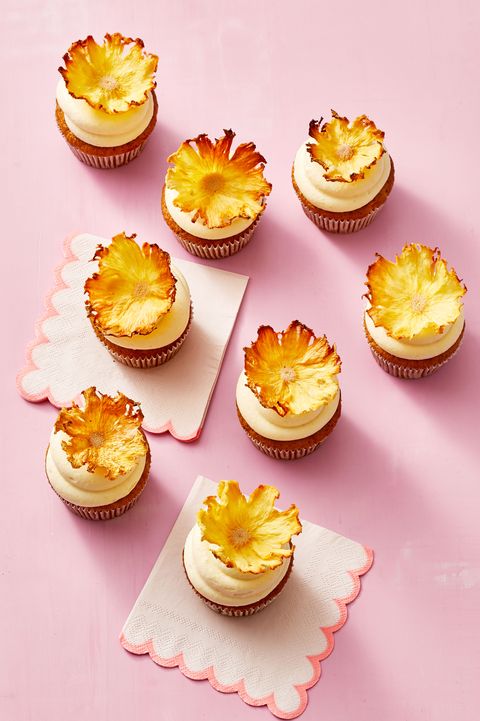 carrot pineapple cupcakes with pink background