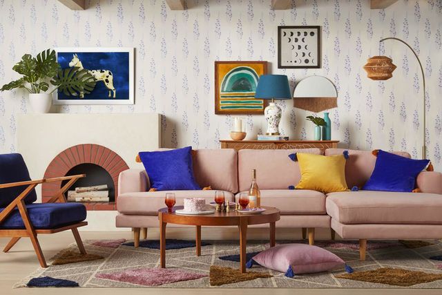 living room with pink sectional and colorful decor