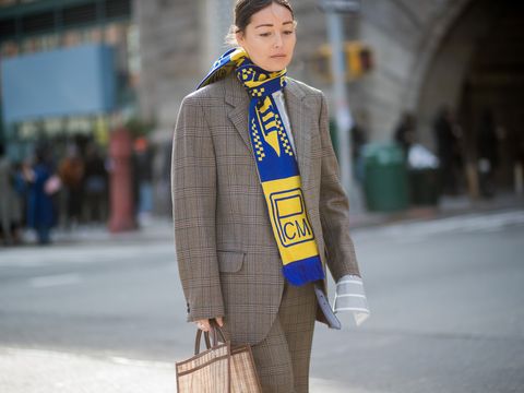 Rachael Wang wearing a football scarf during NYFW