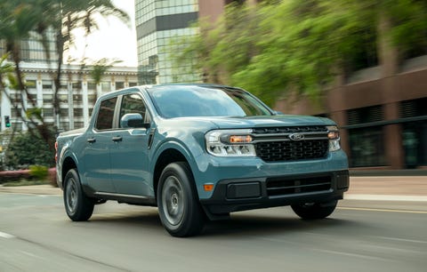 2022 ford maverick hybrid xlt driving down a street