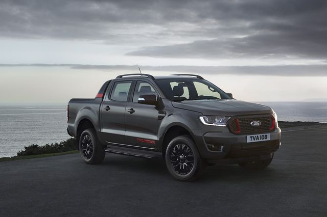 ford ranger thunder parked in front of an ocean with storm clouds rolling in